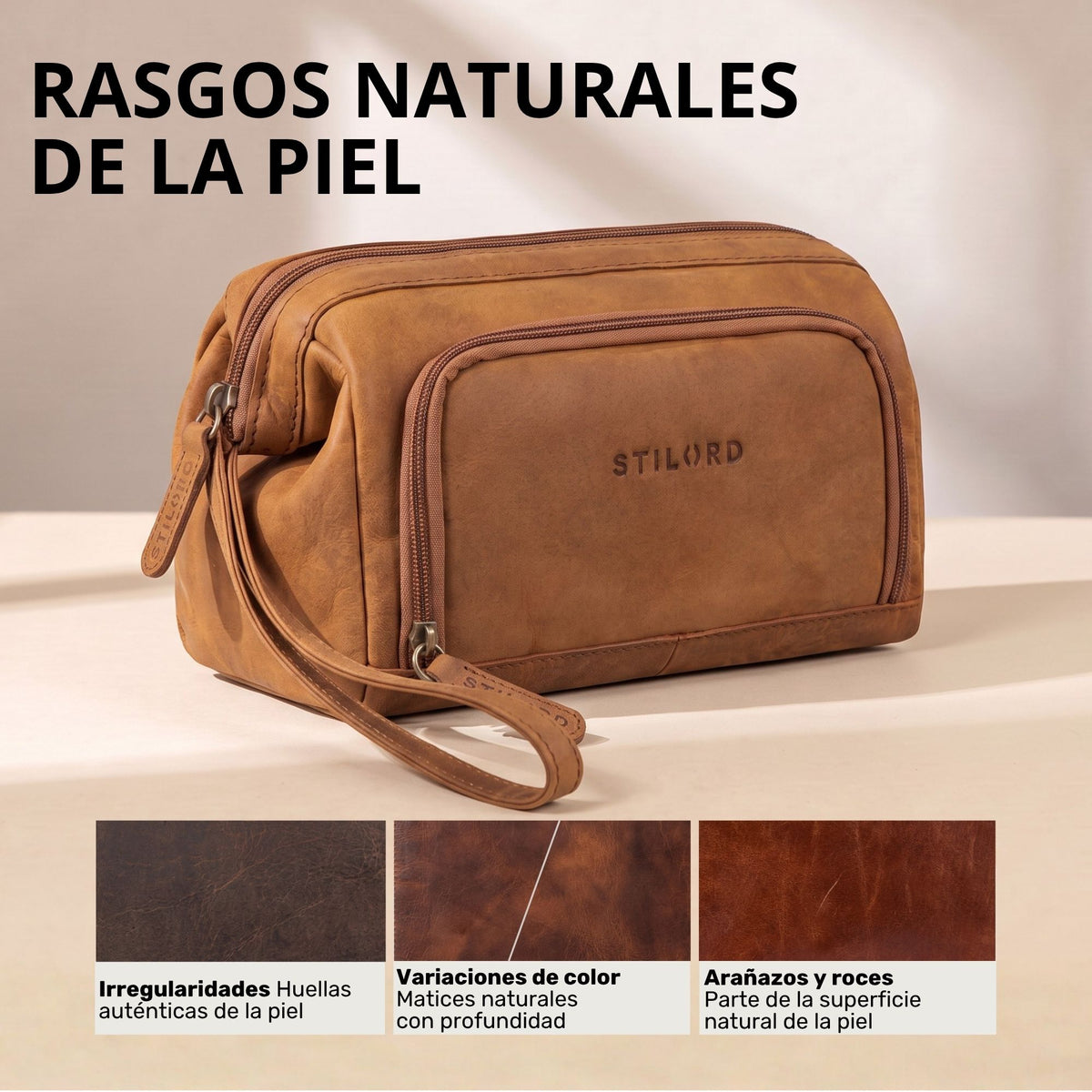 Neceser de cuero color tan, vista frontal con bolsillo con cremallera, asa de muñeca y marca STILORD visible